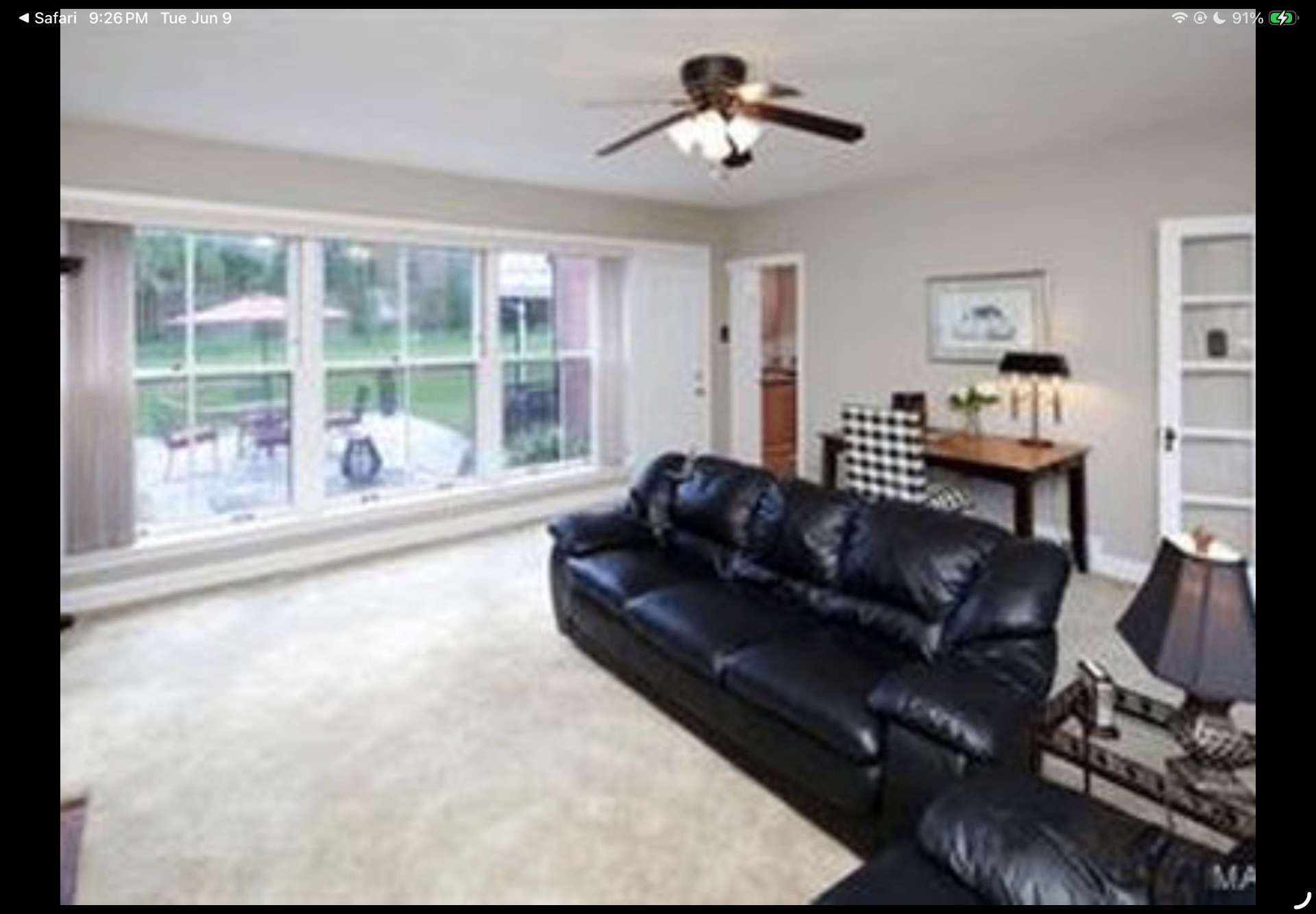 Family room with large picture window overlooking the patio and backyard